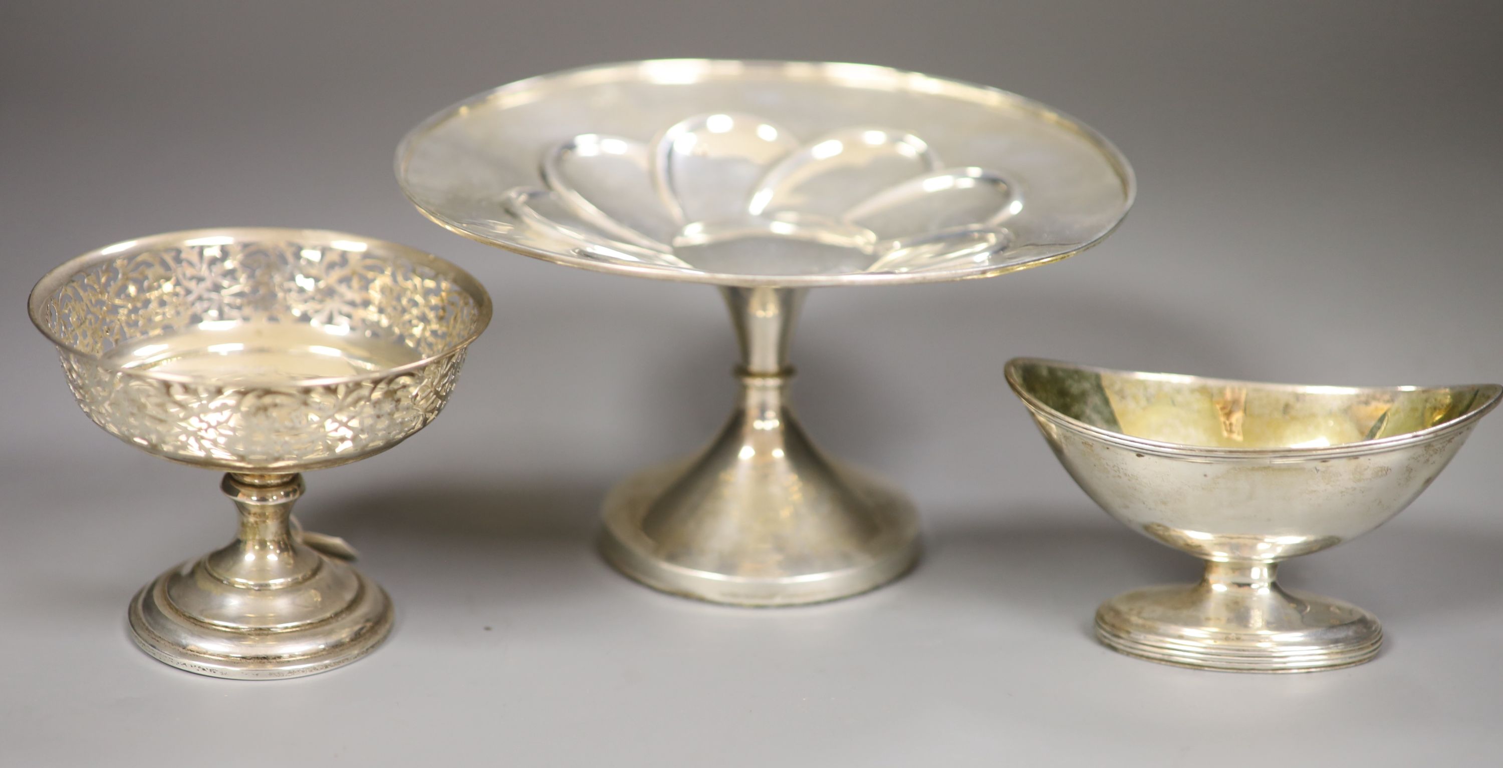 A George III silver salt, London, 1796, a George V silver bon bon dish and a weighted silver tazza, height 10.2cm.
